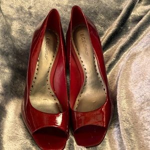 BCBGirls red patent peep hole heels.